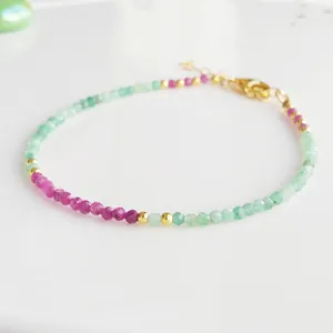 Slim beaded bracelet with natural faceted stones in emerald green and rose pink colors