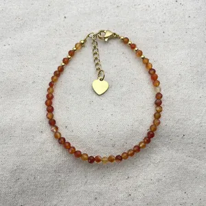 Handmade orange natural stone beaded bracelet with golden heart charm and extension chain