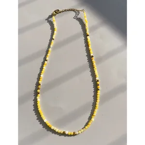 Handmade yellow natural stone beaded necklace with gold spacers and lobster clasp