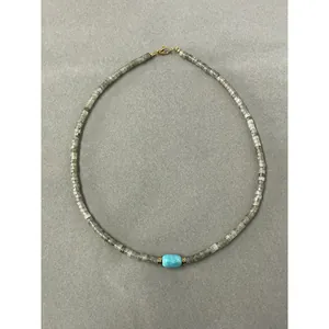 Minimalist natural stone beaded necklace with a turquoise accent and golden lobster clasp