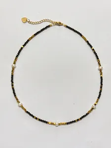 Detail of black spinel choker with freshwater pearls and heart pendant clasp