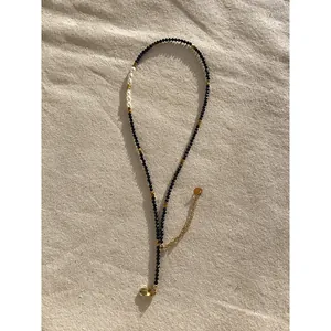 Minimalist black spinel choker necklace with freshwater pearls and gold-plated clasp