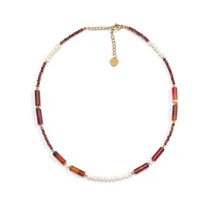 Retro beaded necklace with natural red stones, white pearls, and gold heart pendant charms