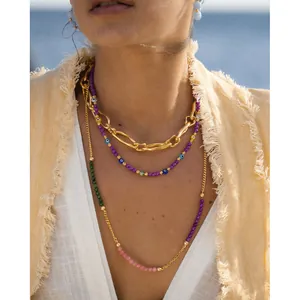 Bohemian gold layered necklace set with colorful evil eye beads and natural stones