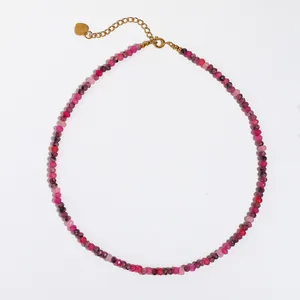 Detailed view of pink and purple beaded stone necklace with gold-plated lobster clasp
