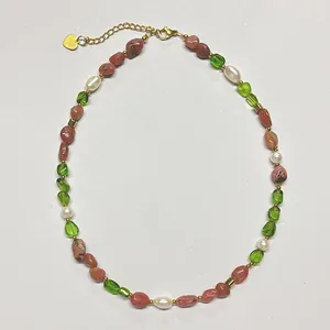 Beaded necklace with pink raw stones, green beads, and white pearls on golden chain