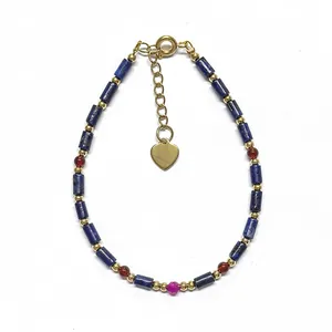 Handmade beaded bracelet with natural blue lapis lazuli stones and golden heart charm