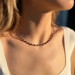 Bohemian turquoise beaded necklace with colorful natural stone beads on a female model