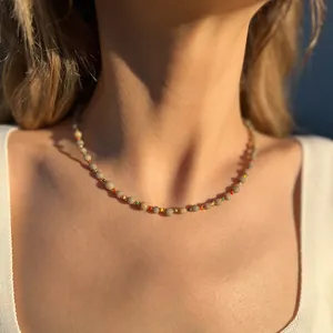 Bohemian turquoise and colorful seed bead necklace on model in natural sunlight