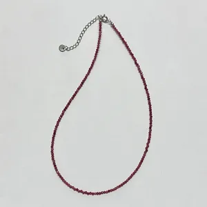 Minimalist beaded necklace with faceted purple stones and adjustable lobster clasp