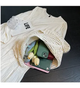 Detail view of large white hollow crochet tote bag showing spacious inner storage capacity
