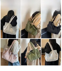 Detailed grid view of assorted colorful corduroy tote bags with embroidery