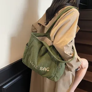 Green corduroy tote bag with white TOTE BAG embroidery for casual daily commute