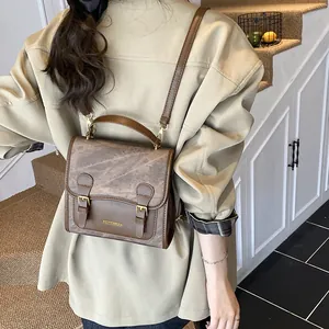 Retro coffee brown PU leather backpack for women with vintage buckle and top handle design
