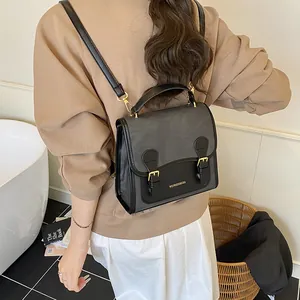 Vintage two-tone faux leather backpack for women with metal buckles and adjustable straps