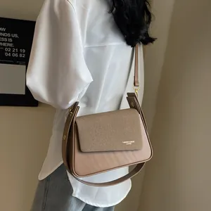 Retro khaki crossbody bag for women featuring a woven texture flap and leather finish