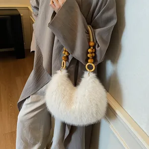 Chic beige plush crescent handbag with elegant wooden bead handle for autumn style