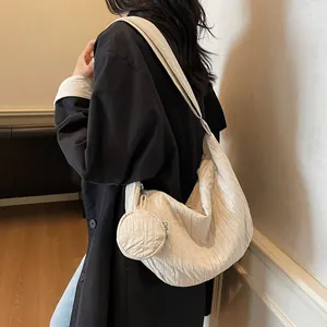 Pleated crescent canvas tote bag in creamy white with small matching round pouch