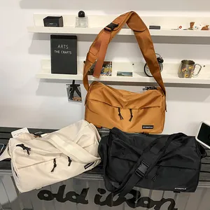 Waterproof nylon crossbody bags in brown, beige, and black with multi-pocket design