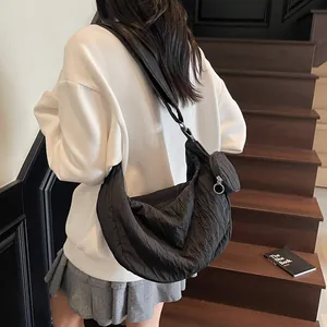 Black pleated tote bag with large capacity and half-moon silhouette for casual wear