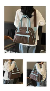 Detail of a large brown and blue contrast tote bag with premium nylon texture and wide strap
