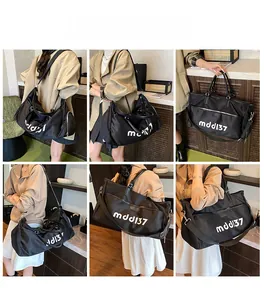 Multiple views of a large black Oxford travel bag with mddl37 print and shoulder strap