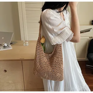 Macro shot of brown hollow woven cotton shoulder bag with intricate mesh pattern