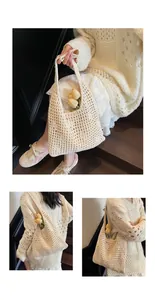 Detail of cream crochet tote bag featuring hollow knit texture and summer beach style