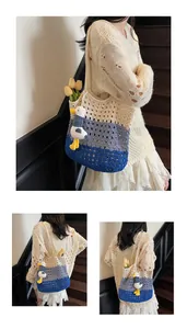 Detail of hollow knit tote bag with tri-color block design and cute duck charm