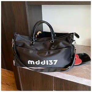 Detail of black travel bag showing independent shoe compartment with red sandals