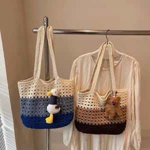 Hollow crochet knit tote bag with color blocking design and cute plush pendant charm