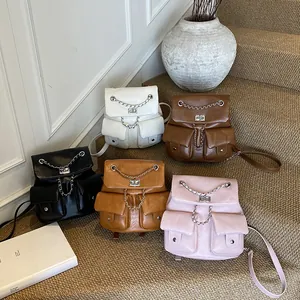 Minimalist chain backpack in textured leather showing five stylish colors for women