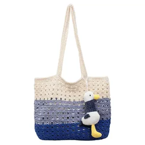 Handmade hollow crochet tote bag in tricolor patchwork with a cute seagull pendant
