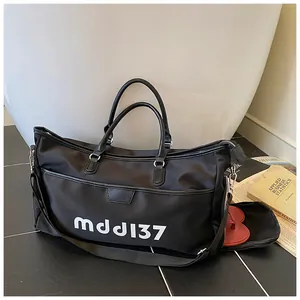 Detail of the large travel bag showing a dedicated side zipper compartment for shoes