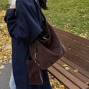 Minimalist dark coffee tote bag in matte suede finish with matching pouch in autumn park