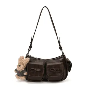 Vintage dark brown faux leather shoulder bag with bow pockets and teddy bear charm