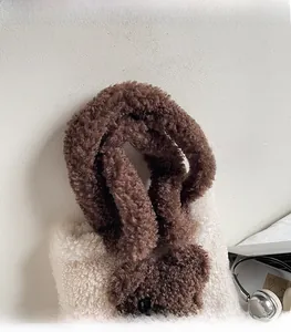 Close-up of cozy teddy bear tote bag showing soft plush faux fur and comfortable strap