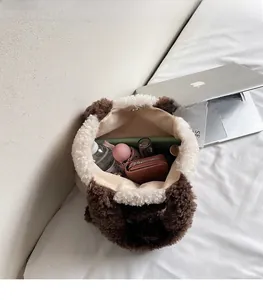 Spacious interior of plush teddy tote bag showing storage for water bottle and umbrella