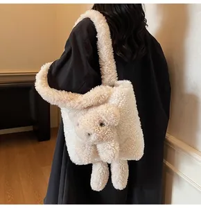 Close-up of cream fuzzy lamb wool tote bag with cute 3D plush bear detail