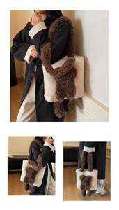 Close-up of plush bear charm on white and brown fuzzy shearling tote bag