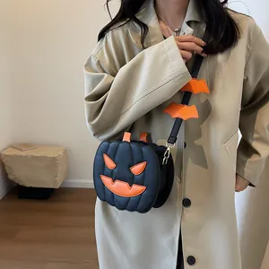 Halloween pumpkin crossbody bag in black leather with orange bat shoulder strap decorations
