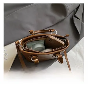 Internal view of the caramel bucket bag showing its large capacity for daily essentials