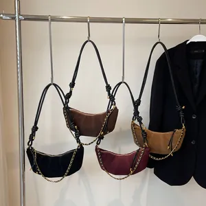 Vintage frosted croissant bags in four colors with chain detail and knotted straps