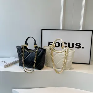 Chic quilted tote bags with gold chain straps in black and beige faux leather