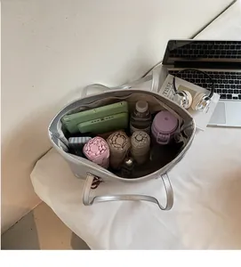 Top view of spacious interior of silver metallic tote bag showing large storage capacity
