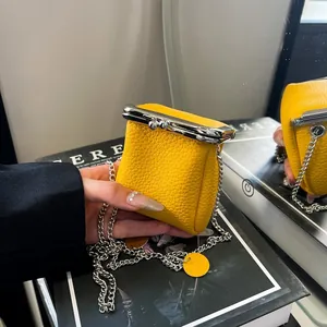 Mini yellow lychee leather lipstick pouch with silver ball clasp and chain strap