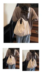 Detailed view of beige canvas crossbody bag showing large capacity and soft texture