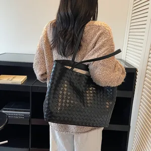 Retro black woven leather tote bag with Intrecciato pattern and dual shoulder straps