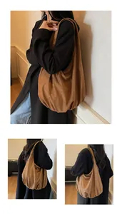 Detail of dark brown suede tote bag showing soft texture and slouchy hobo bag design