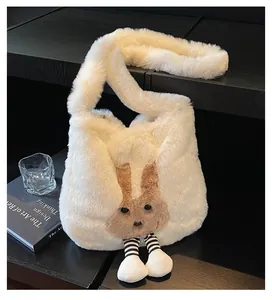 Detail of cute plush bunny tote bag featuring white faux fur and striped leg charms